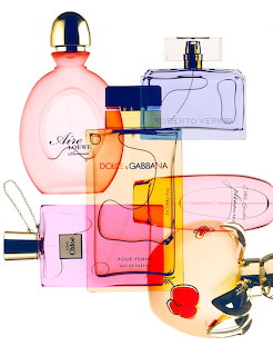 Collage of several perfume bottles overlapping in pink, blue, orange and purple colors