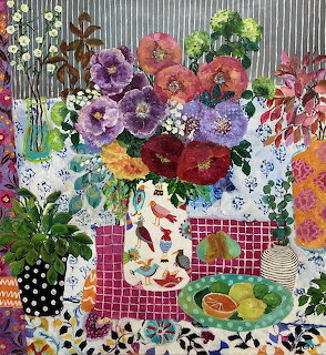 Colorful painting of flowers in a decorative vase on patterned tablecloths with fruit bowl and mixed patterns
