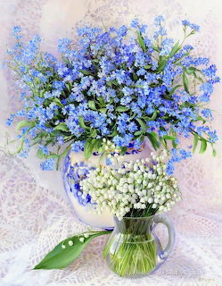 Painting of blue flowers and white lilies in two vases on a soft pastel background