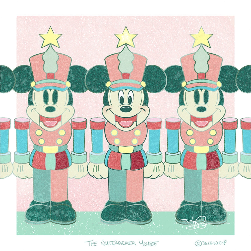 Three Mickey Mouse nutcracker soldiers in pink and teal uniforms with gold stars standing in a row