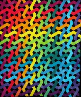Vibrant quilt with interlocking rainbow-colored curved geometric shapes on black background
