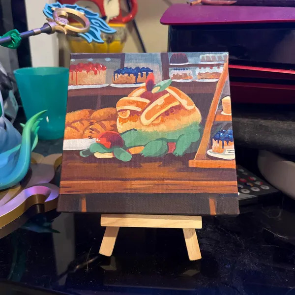 Small Appletun canvas painting on a mini wooden easel on a desk