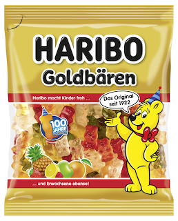 Yellow gummy bear candy bag with fruit images and a cartoon bear mascot