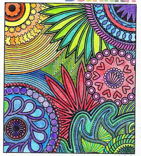 Colorful abstract zentangle drawing with mandala patterns, swirls, and intricate geometric designs in bright rainbow hues