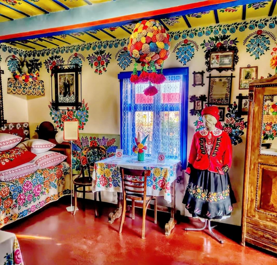 Brightly decorated Mexican interior with folk art, colorful textiles, and traditional ornaments