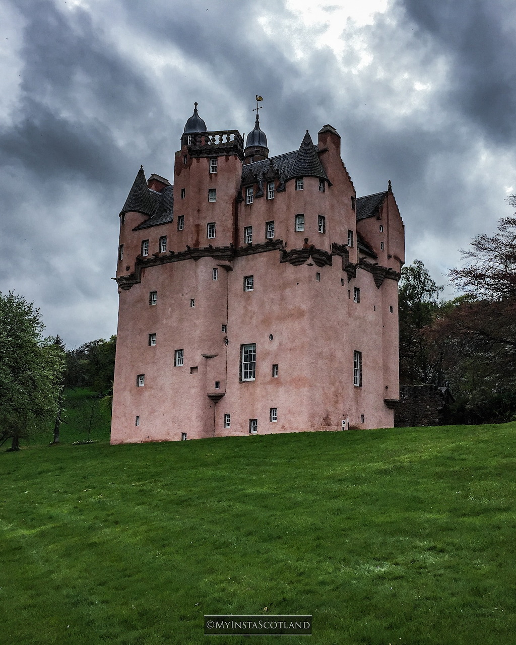 Pink Craigievar Castle with turrets in Aberdeenshire, Scotland