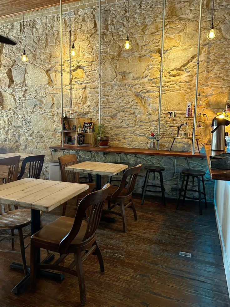 Interior of a cozy coffee shop with wooden counter and warm lighting