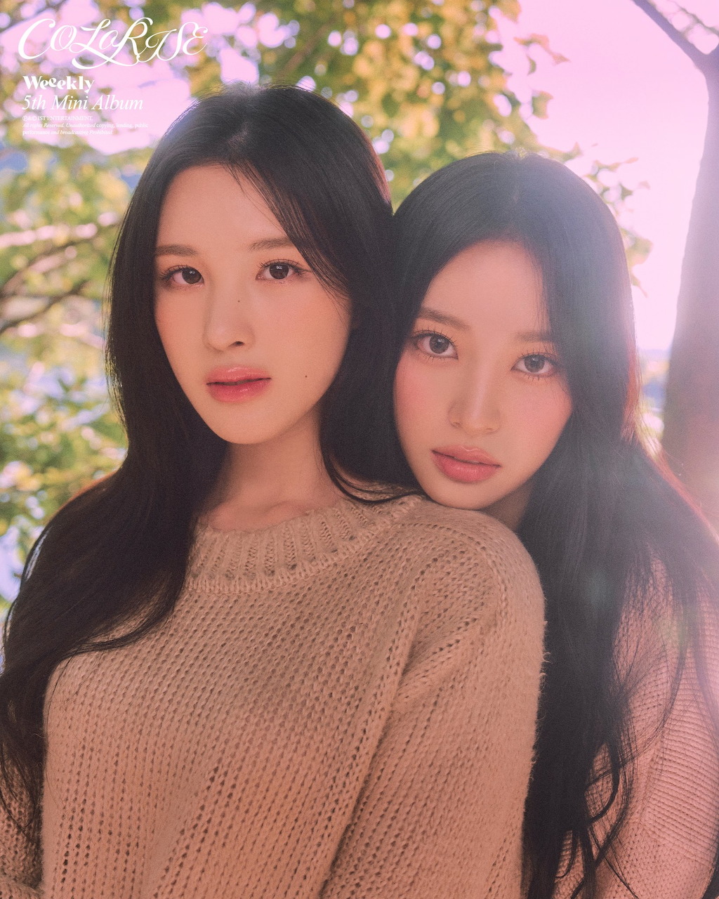 Members of K-pop girl group Weeekly posing together in a group portrait