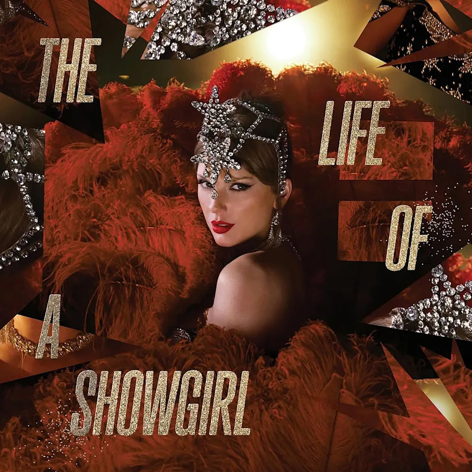 Album cover art of a glamorous showgirl with a jeweled headpiece, red feathers, and bold text