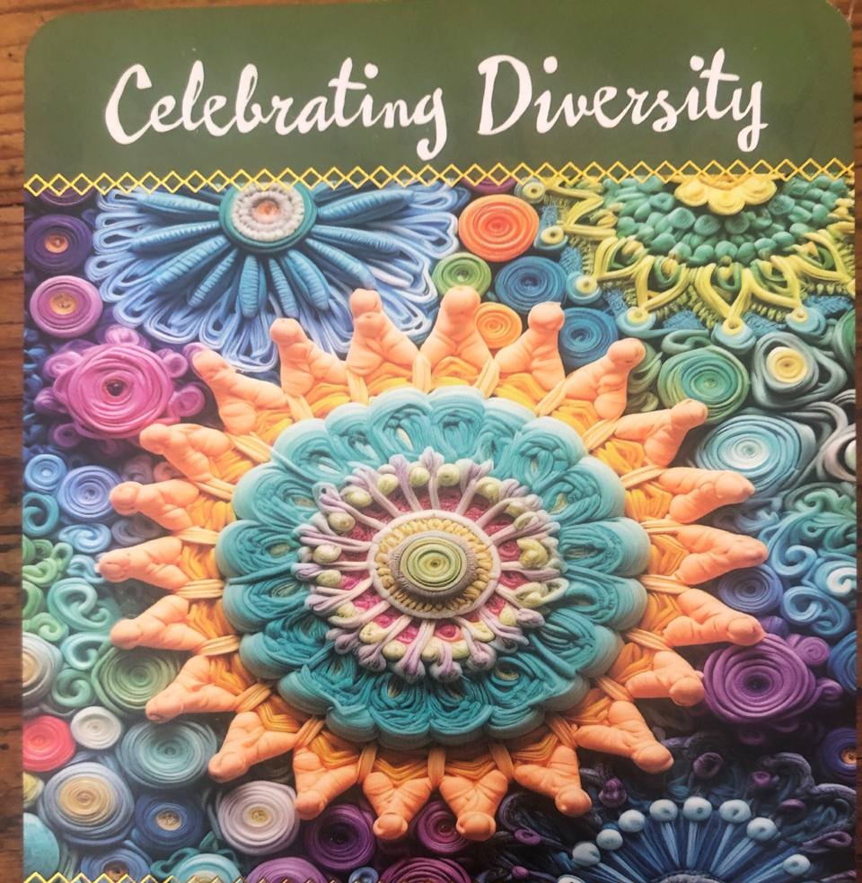 Colorful paper quilling mandala with the text Celebrating Diversity at the top