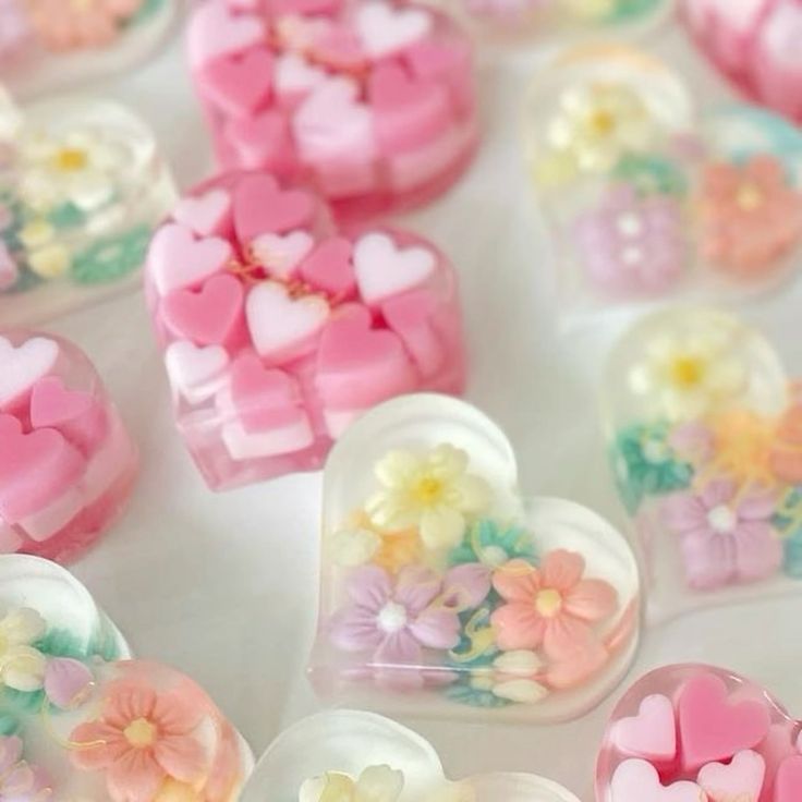 Pastel heart-shaped soap bars decorated with small flowers and pink heart pieces