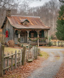 Rustic log cabin with metal roof and wooden fence in rural autumn setting