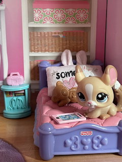 Group of small pastel-colored pet toy figures with big eyes