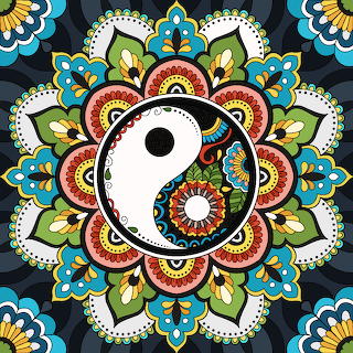 Colorful yin yang symbol inside a detailed floral mandala on a dark background