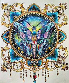 Colorful illustrated moth in ornate gold mandala frame with galaxy background and decorative scrollwork