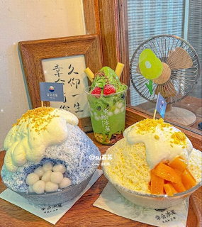 Three bowls of colorful Korean bingsu shaved ice desserts with fruit toppings