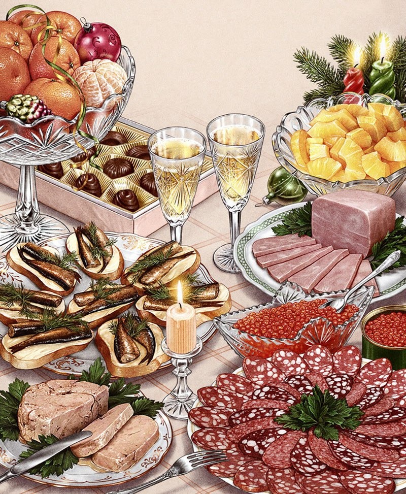 Overhead view of elaborate holiday dinner table with meat, seafood, fruit, bread, and festive decorations