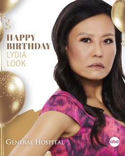 Portrait poster of a woman in a pink dress with gold balloons and birthday text