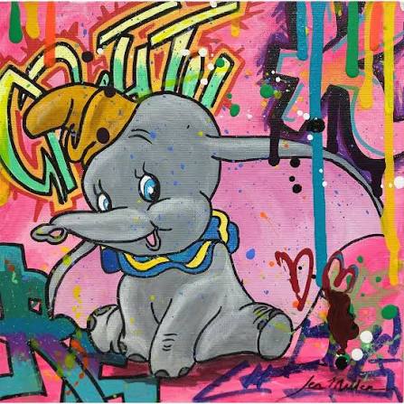 Cartoon Dumbo elephant sitting with colorful graffiti background