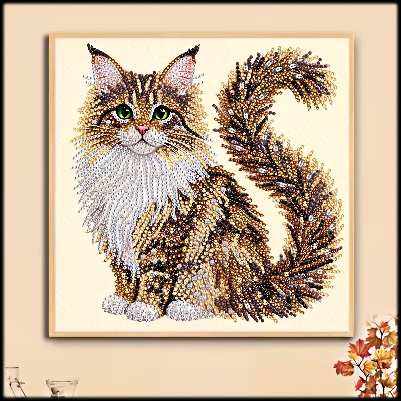 Framed diamond painting of a fluffy Maine Coon cat with green eyes and a curled tail on a light wall