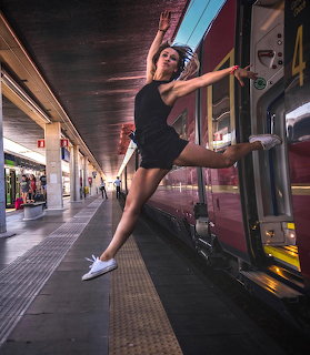 Woman Leaping at Train Station