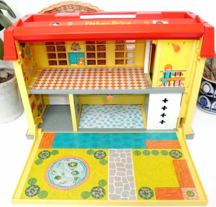 Vintage Fisher-Price dollhouse toy with red roof, yellow interior rooms, and fold-out play mat