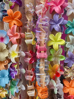 Tropical aesthetic with hibiscus flowers and palm leaves in bright sunny colors