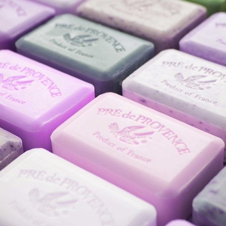 Close-up of lavender and gray embossed soap bars arranged in rows