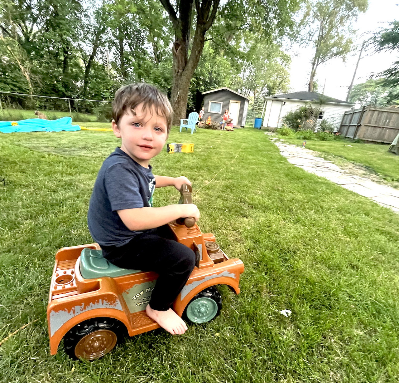 Boy on Toy Car