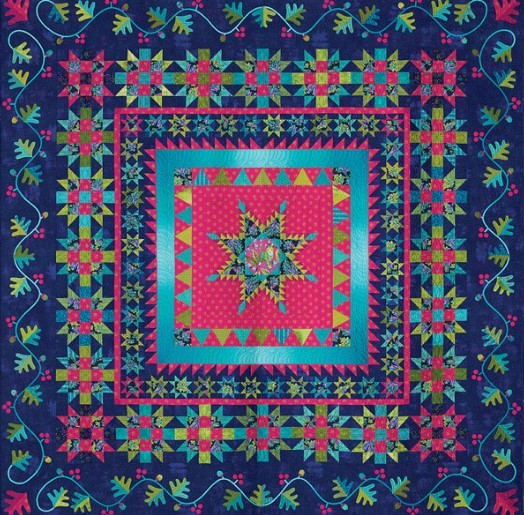 Colorful quilt with floral star pattern in pink, teal, and blue with decorative borders