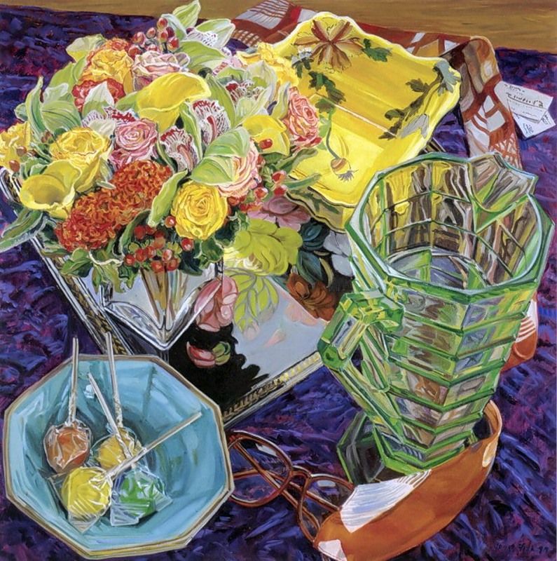 Colorful still life painting with flowers, glass vases, candy, and yellow fabric on a tabletop