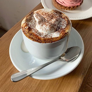 cappuccino with thick foam and cocoa powder