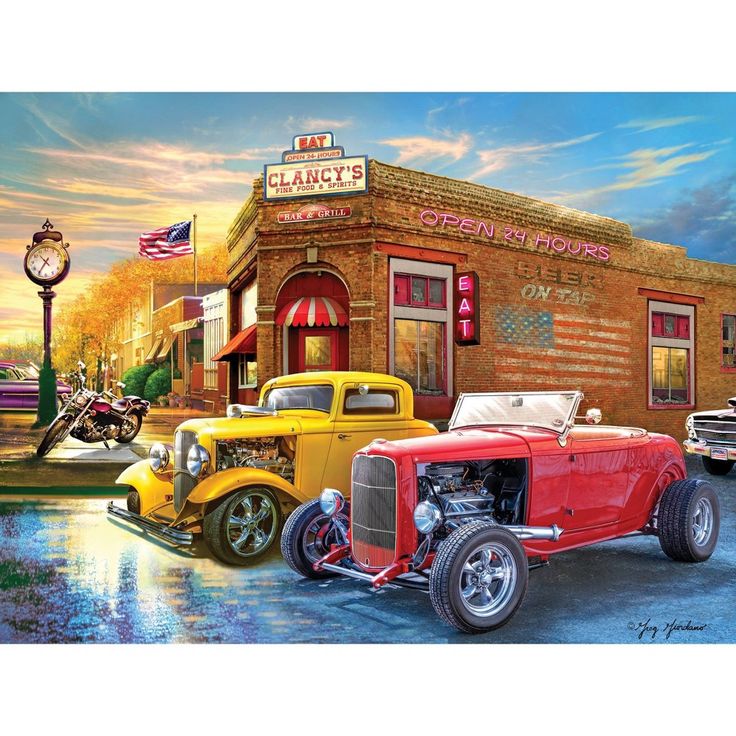 Vintage hot rod cars parked outside classic American diner at sunset with dramatic sky