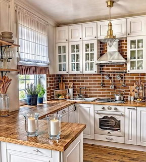 Bright white rustic kitchen with wood countertops, brick backsplash, cabinets, and a small island