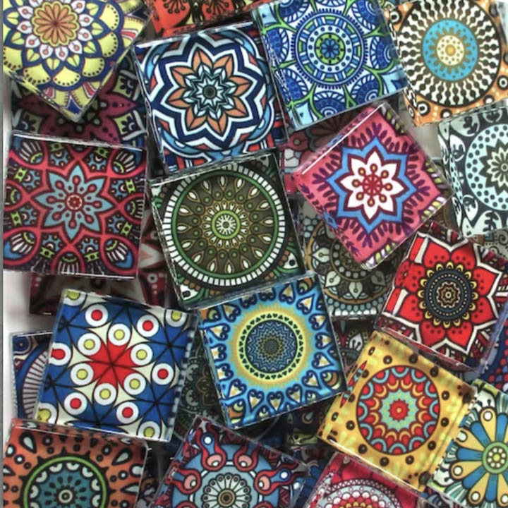 Assorted decorative ceramic tiles with colorful mandala and geometric patterns arranged in a collage