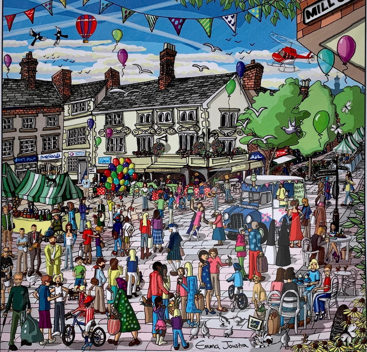 Busy illustrated village square with market stalls, balloons, bunting, and many people