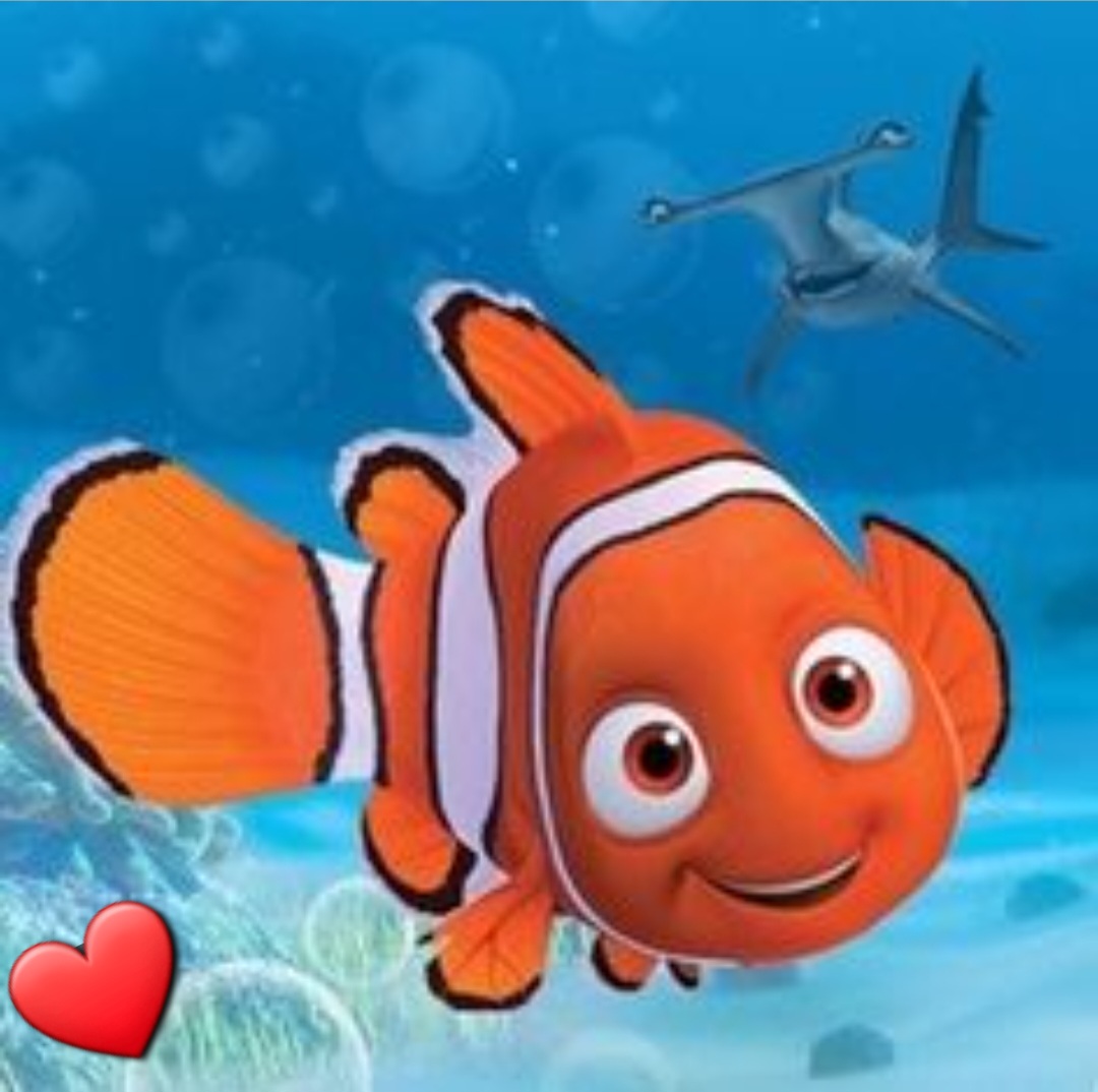 Cartoon orange and white clownfish character smiling in underwater scene