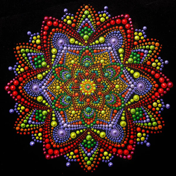 Circular mandala made of multicolored dots arranged in symmetrical patterns on black background