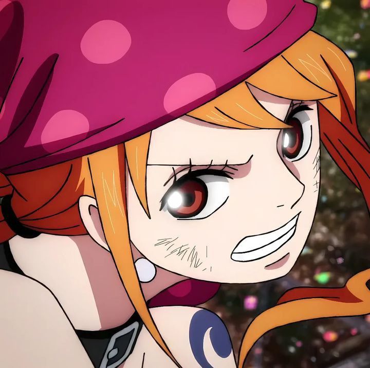 Anime character Nami from One Piece with orange hair and pink polka dot hat smiling