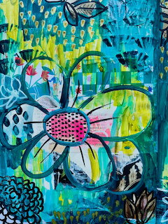 Abstract painting of colorful flower with pink polka dot center on blue-green textured background
