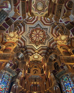 Ornate golden ceiling with geometric patterns and arches inside Cardiff Castle Wales