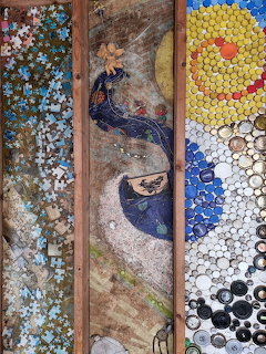 Vertical mosaic artwork with a peacock-like bird and abstract circular patterns in three panels