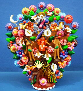 Colorful Mexican árbol de la vida folk art sculpture with flowers, figures, and animals