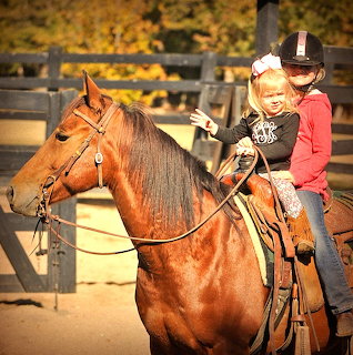 Two Girls Riding Horse