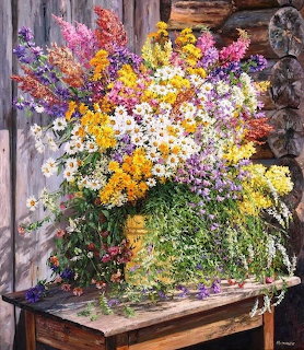 Colorful wildflower bouquet in a rustic vase on a wooden table