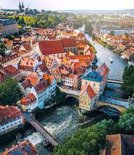 Aerial view of Bamberg old town with red roofs, river, and church spires