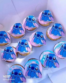 Blue Stitch character cupcakes with white frosting in a white box