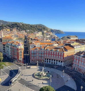 Aerial view of Nice, France with historic buildings, plaza, and Mediterranean Sea