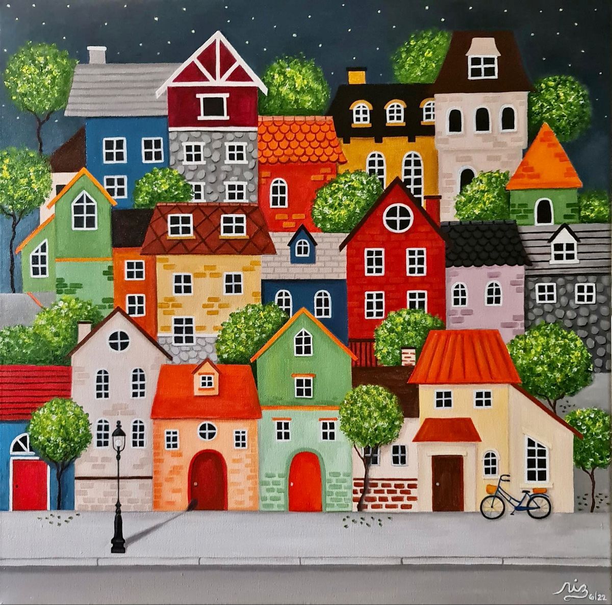 Folk art painting of clustered colorful houses on a hill with trees and bicycle under night sky