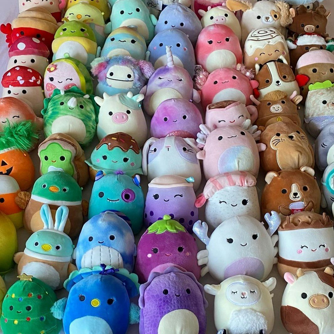 Grid of colorful Squishmallow plush toys in various animal designs